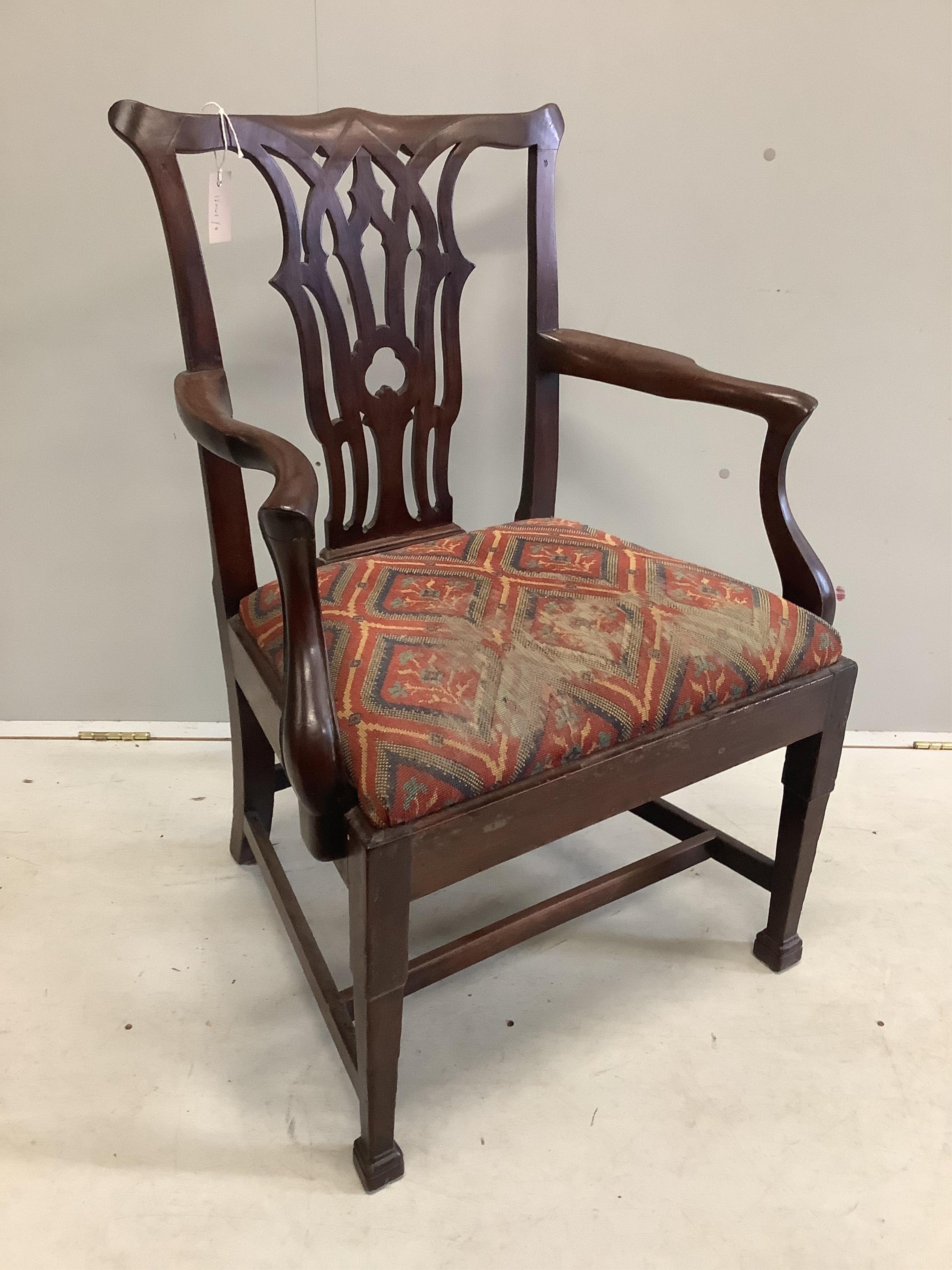 A George III mahogany elbow chair, width 59cm, depth 48cm, height 96cm. Condition - fair